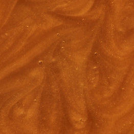 Close-up of a brown, textured surface of Manuka Health Manuka Honey Reserve MGO 1000+.