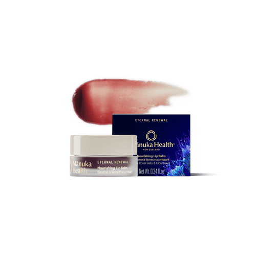 Manuka Health Eternal Renewal Nourishing Lip Balm packaging with a swatch of color on a white background.