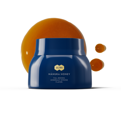 Ultra Manuka Honey MGO 800+ Blue Jar with honey drips on a white background.
