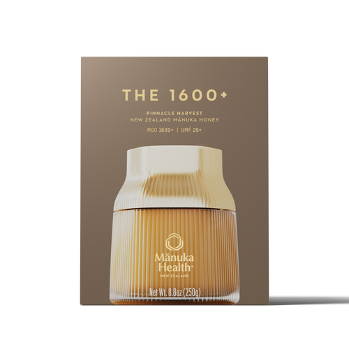 Manuka Health Manuka Honey Pinnacle Harvest MGO 1600+ honey jar with packaging on a white background.