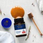 Manuka Health Original MGO 573+ Manuka Honey jar spilled with honey.