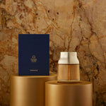 Manuka Honey Pinnacle Harvest MGO 1600+. Decorative vase and box on gold stands against a textured stone wall.
